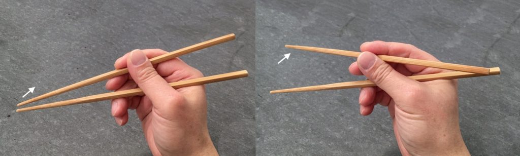 Standard Grip with Sideway Swing held mid-chopsticks, seen from the side