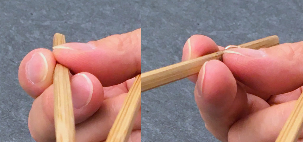 Flattened thumb pose for Standard Grip, seen from the front to illustrate rolling of top stick from closed to open posture, as planetary gears - close-up