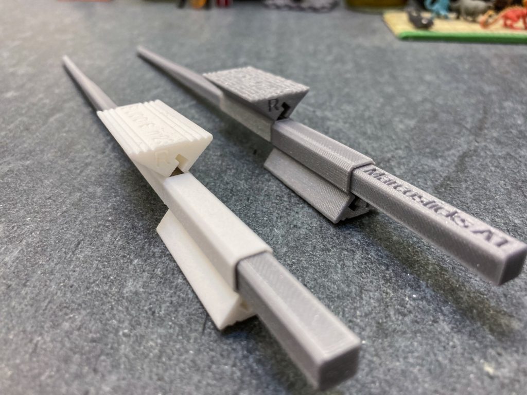 Marcosticks - model B1 Chopstick buddies - White SLS PA2200 chopstick buddies vs silver gray FDM PLA, attached to model A marcostick - IMG_4056