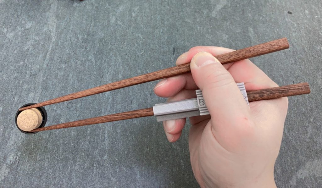 Chopstick Buddies - two piece - FDM - on nice chopstick - Thumb wide ring narrow - Standard Grip Postures - Side View