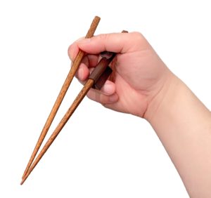 Marcosticks - model B2 Chopstick Buddies - two piece - Prusa - Mystic Brown - on nice chopstick - in a hand - Addresses chopstick cramps - IMG_4881-transparent BG-scaled